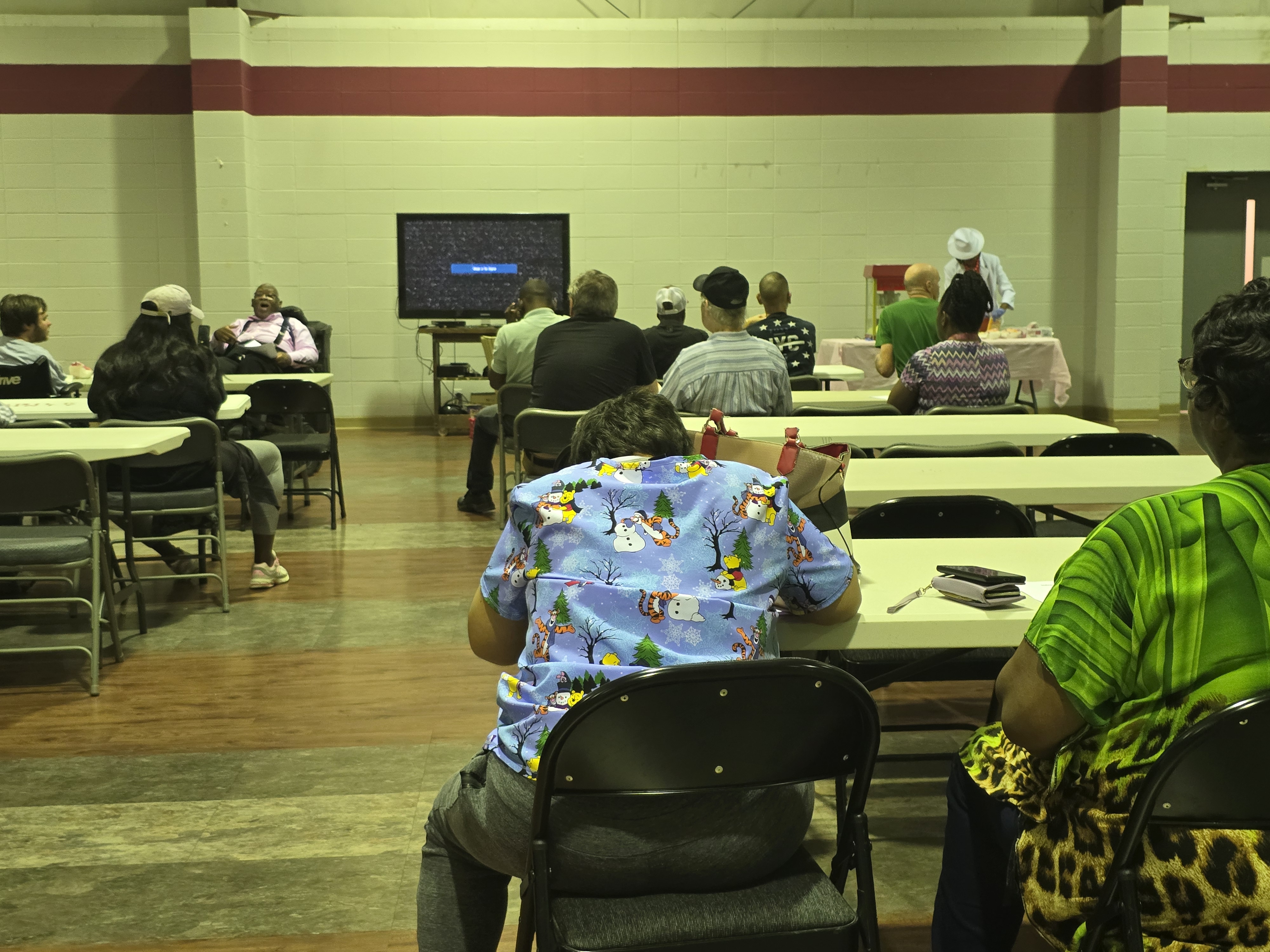 Members ready to watch a documentary on living well with disabilities, fostering empathy and shared understanding.