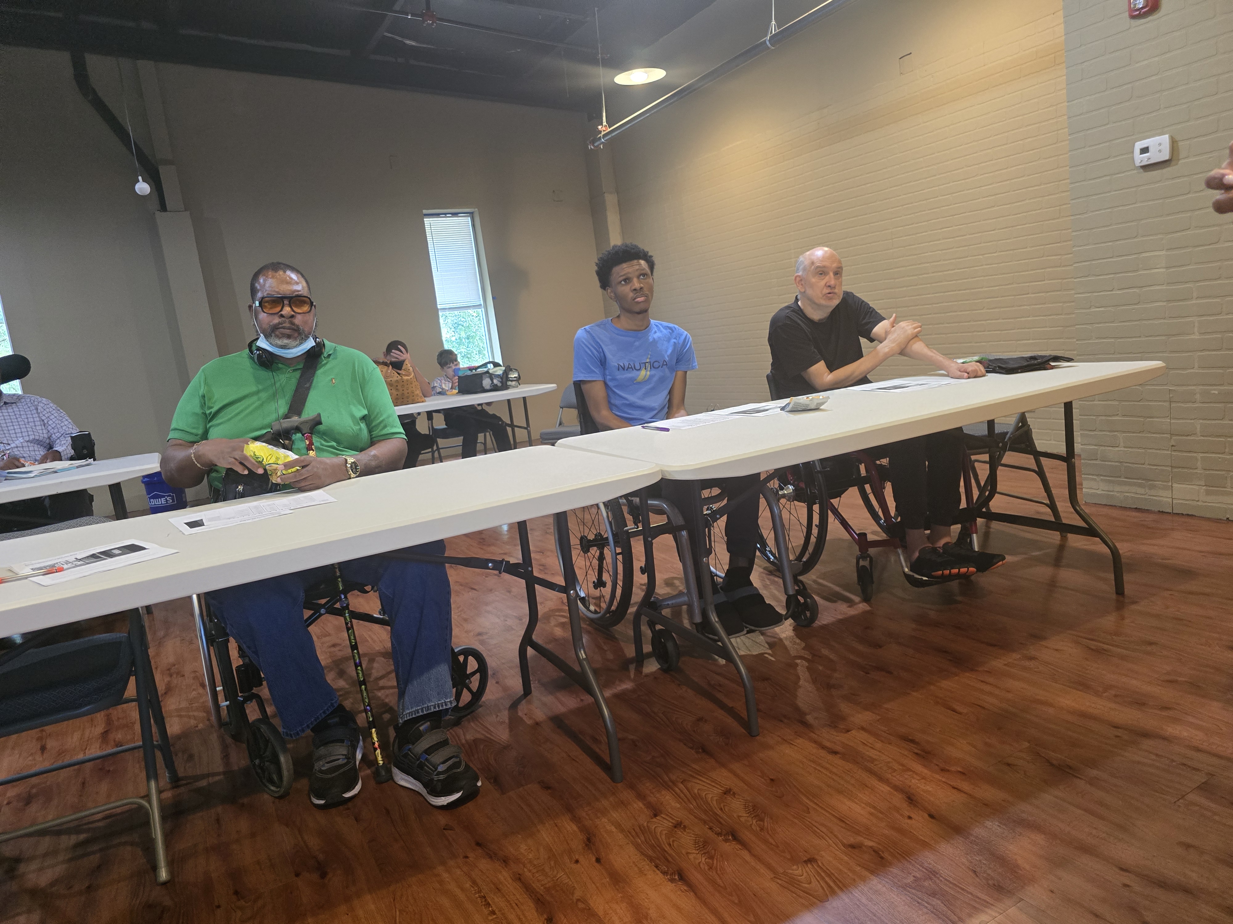 Spinal Cord Injury Support Group members participating in a discussion during their September 2026 meeting.