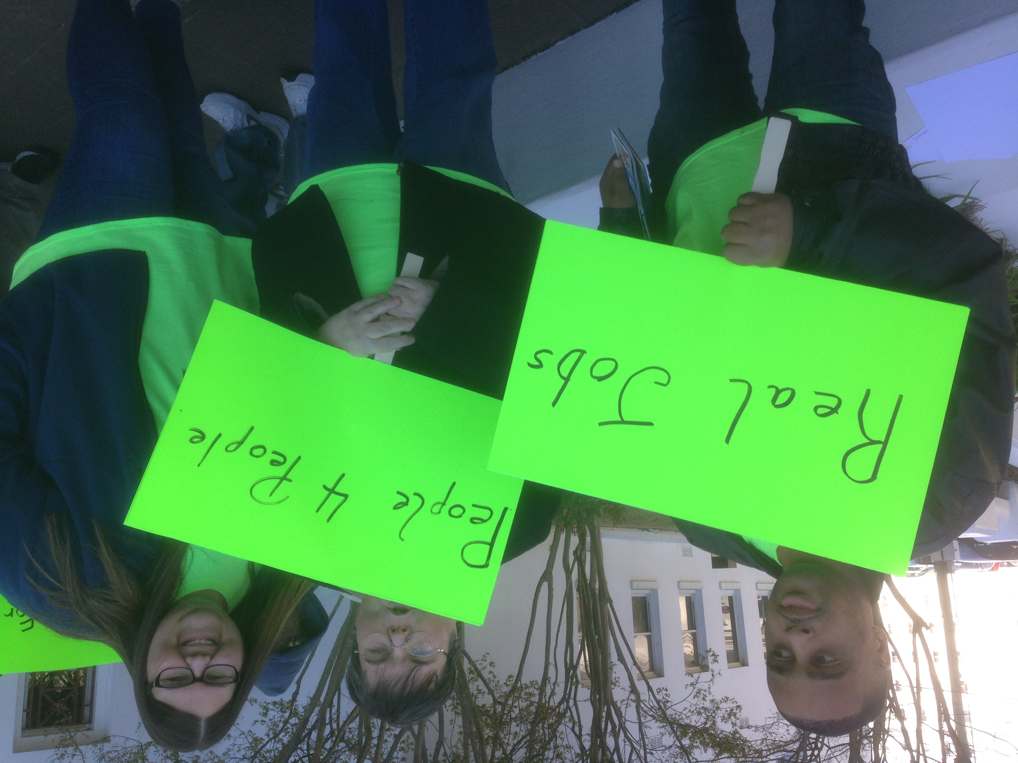 Participants with banners at the rally, 2018.