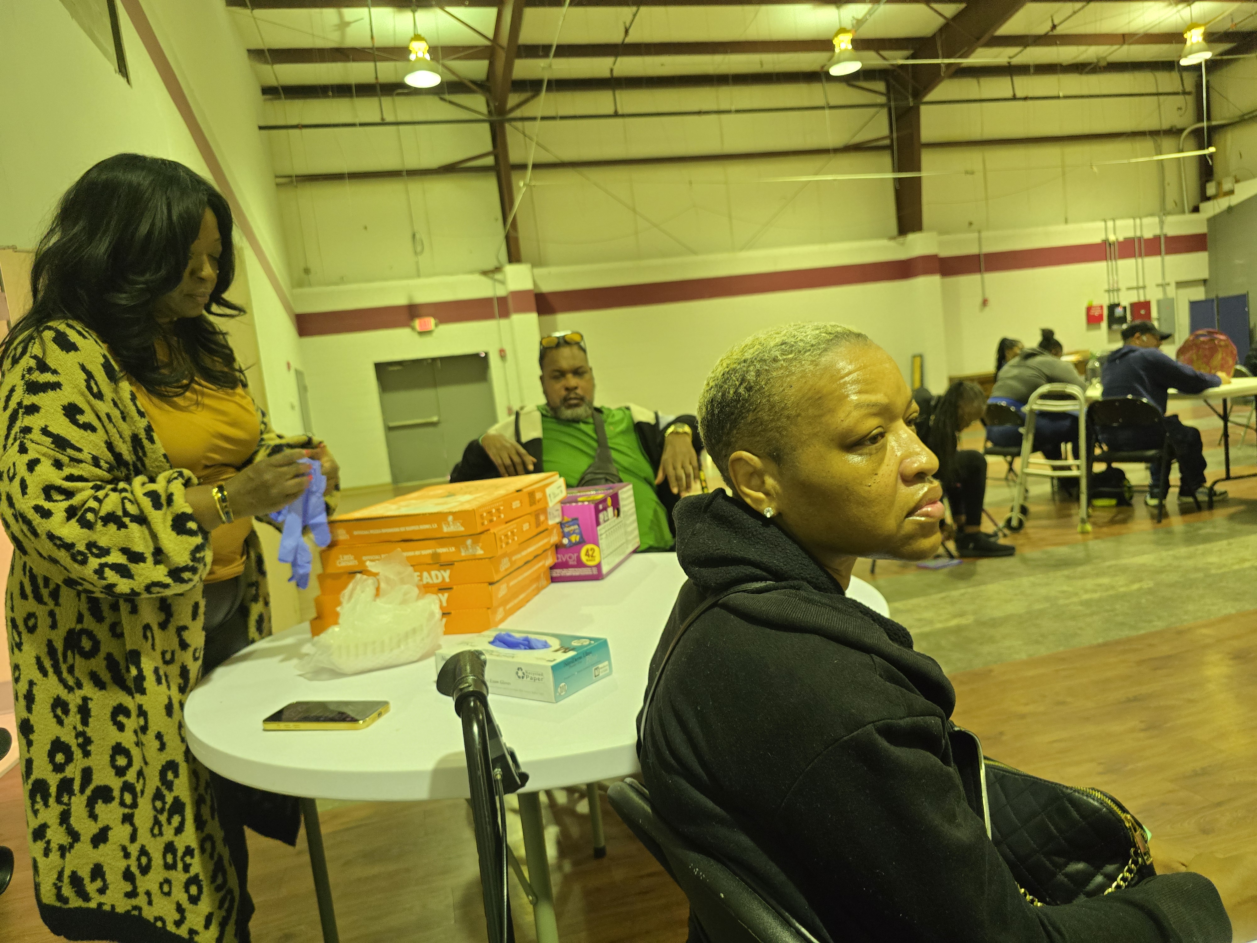 Community, conversation, and support in the background while refreshments were set up for everyone during the Alabama Arise visit.
