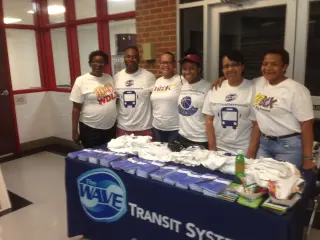 Volunteers and Mobile Wave Transit staff at wheelchair-basketball fundraiser