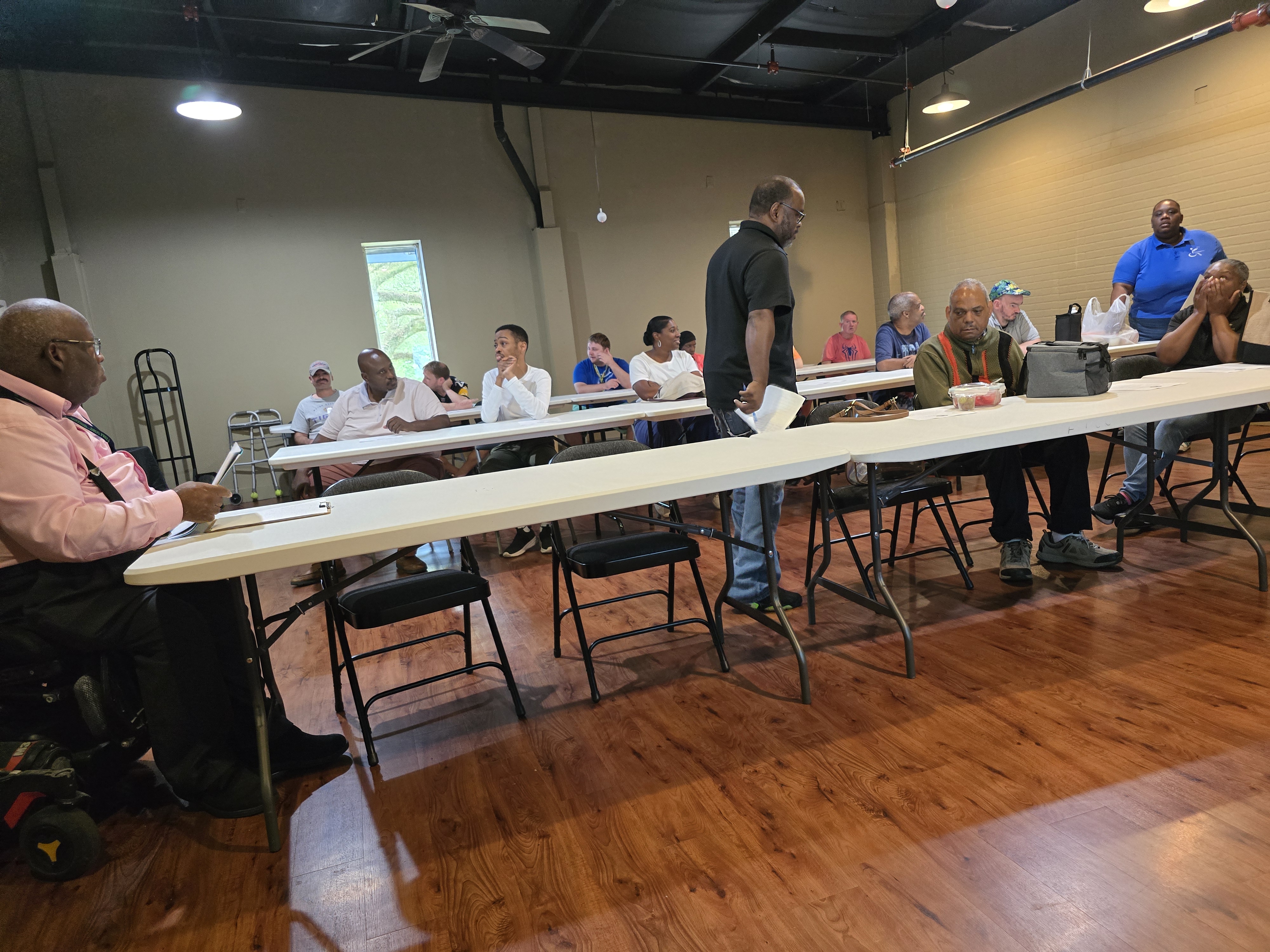 Members coming in and getting ready for the meeting to start.